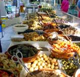 He sells almost 40 kinds of olives and salads